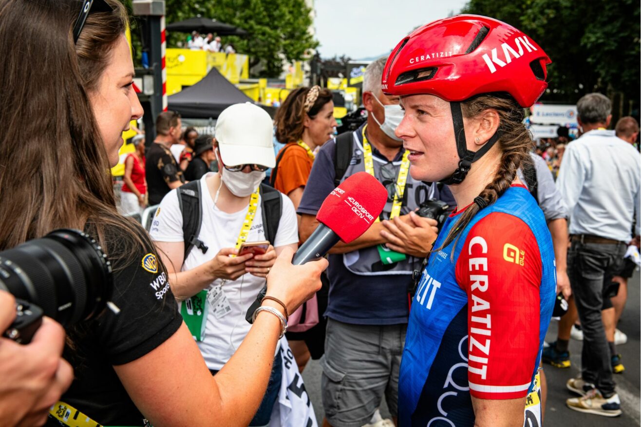 Professional cyclist being interviewed after a race.